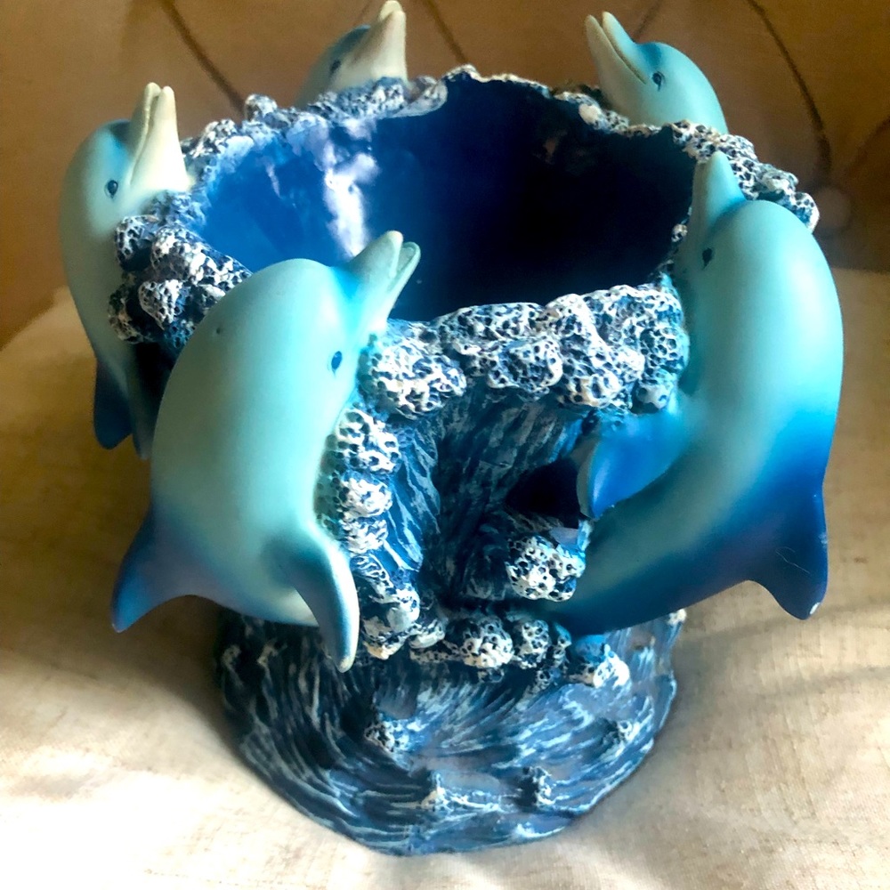 Dolphins candle or fruit holder.